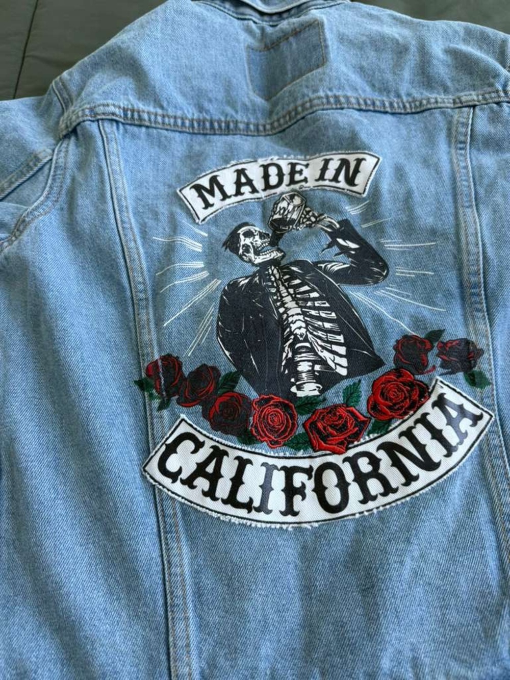 Levi's Light Blue Denim Jacket with Skeleton & Red Rose Back Patch